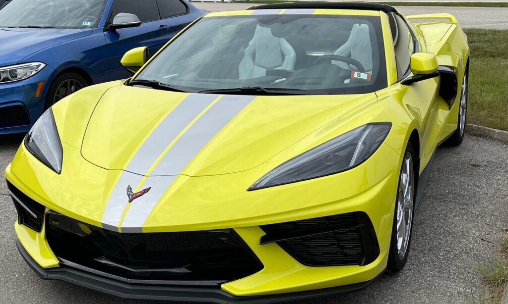 Yellow Corvette with Silver Racing Stripes showcasing premium mobile PPF, vinyl wrap, and pinstriping installation for Corvette owners and dealerships.