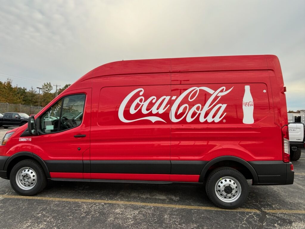 red coca-cola branded conversion van - view from the side