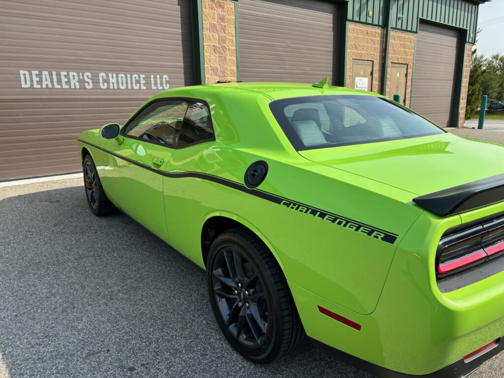 Lime green Dodge Challenger with vinyl stripes in black
