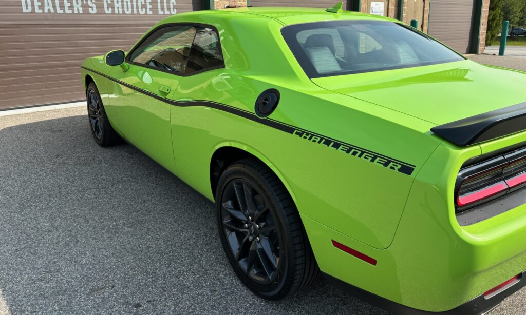 Lime green Dodge Challenger with vinyl stripes in black